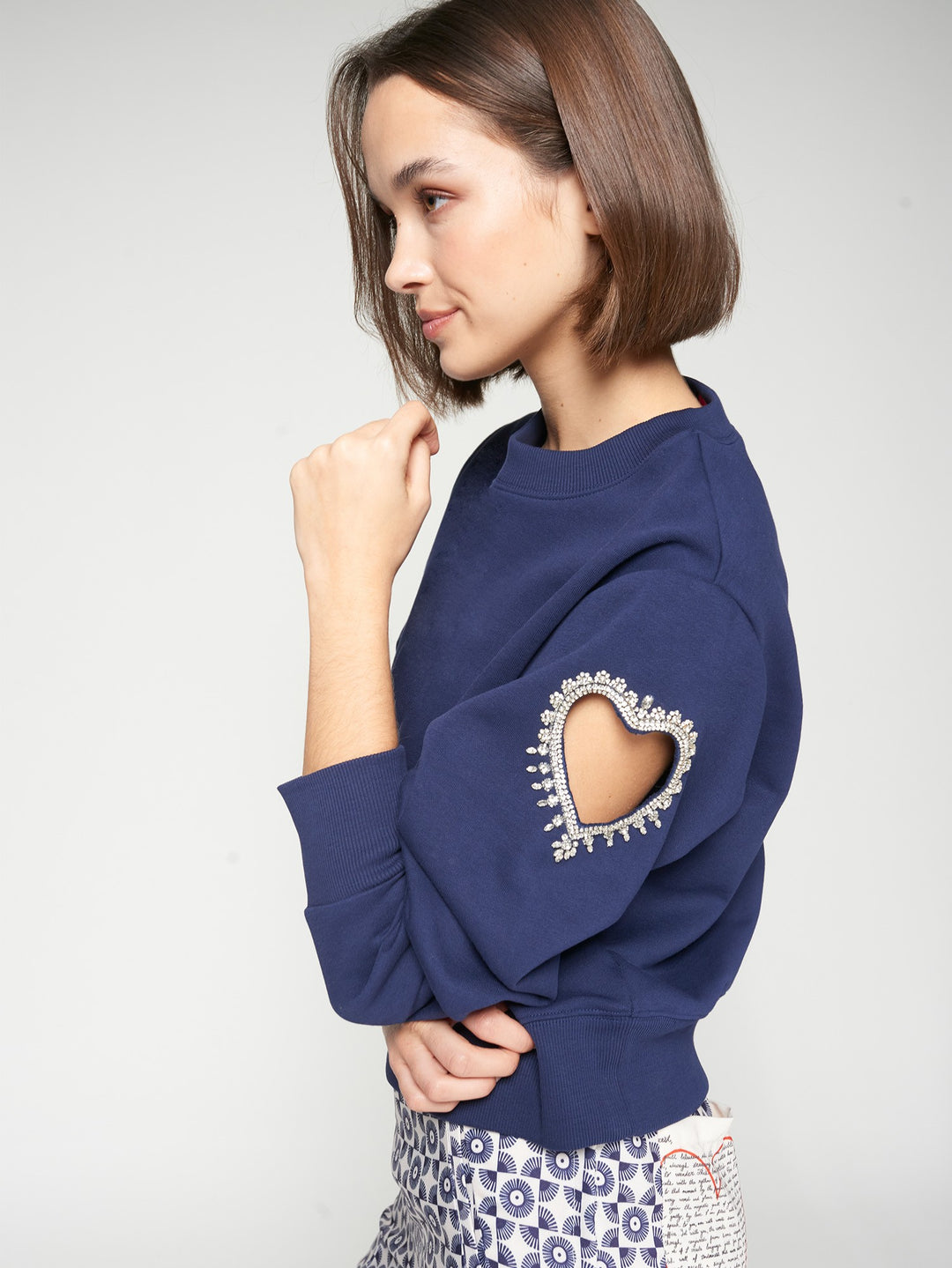 SWEATSHIRT WITH HEART CUT-OUT AND BEADING