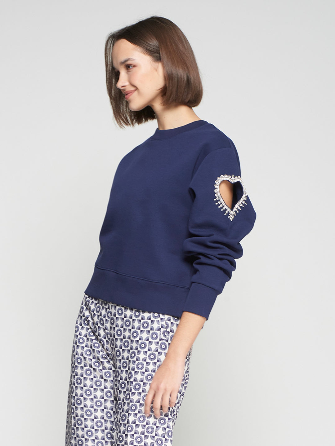 SWEATSHIRT WITH HEART CUT-OUT AND BEADING