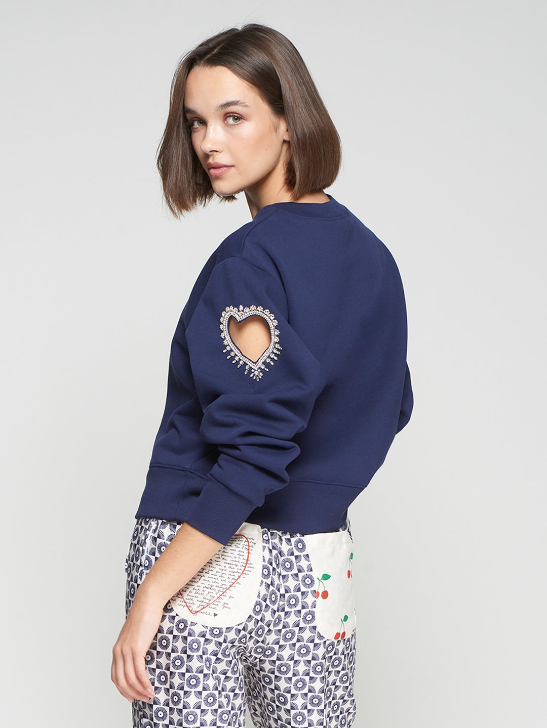 SWEATSHIRT WITH HEART CUT-OUT AND BEADING